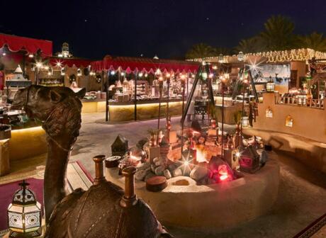 Experience traditional Arabic food and entertainment at Al Hadheerah in Dubai.