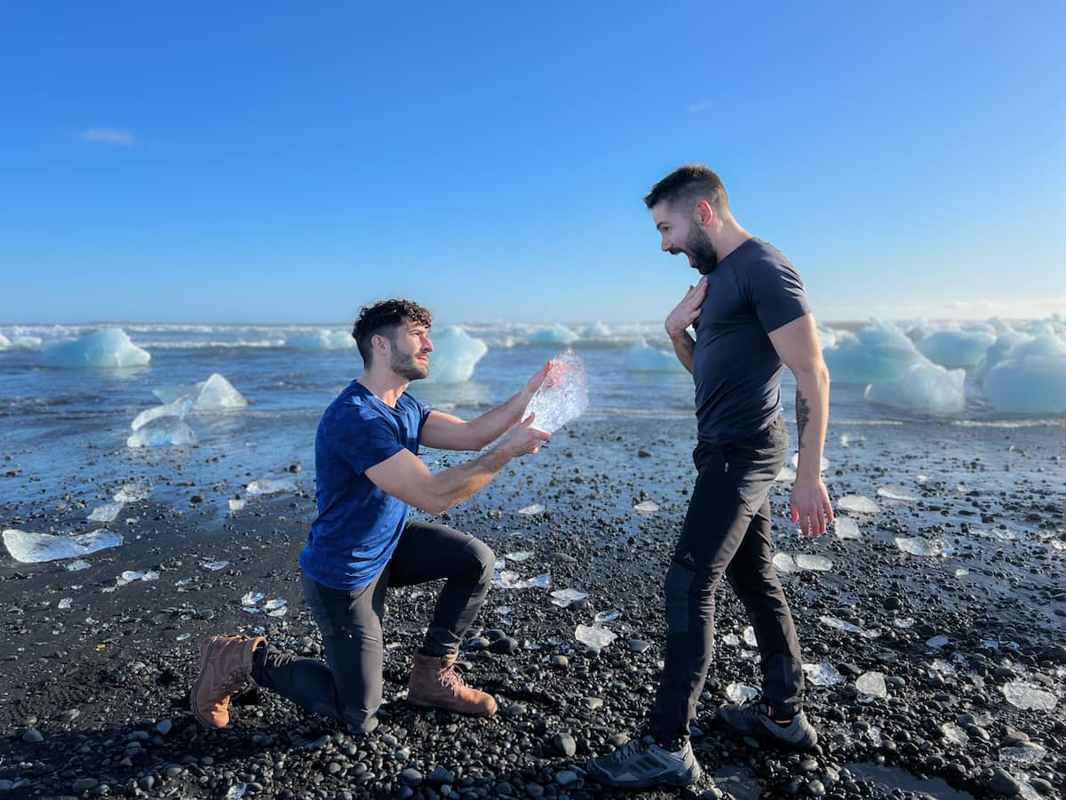 Nomadic Boys, gay couple Stefan and Sebastien proposing at the famous Diamond Beach in iceland.