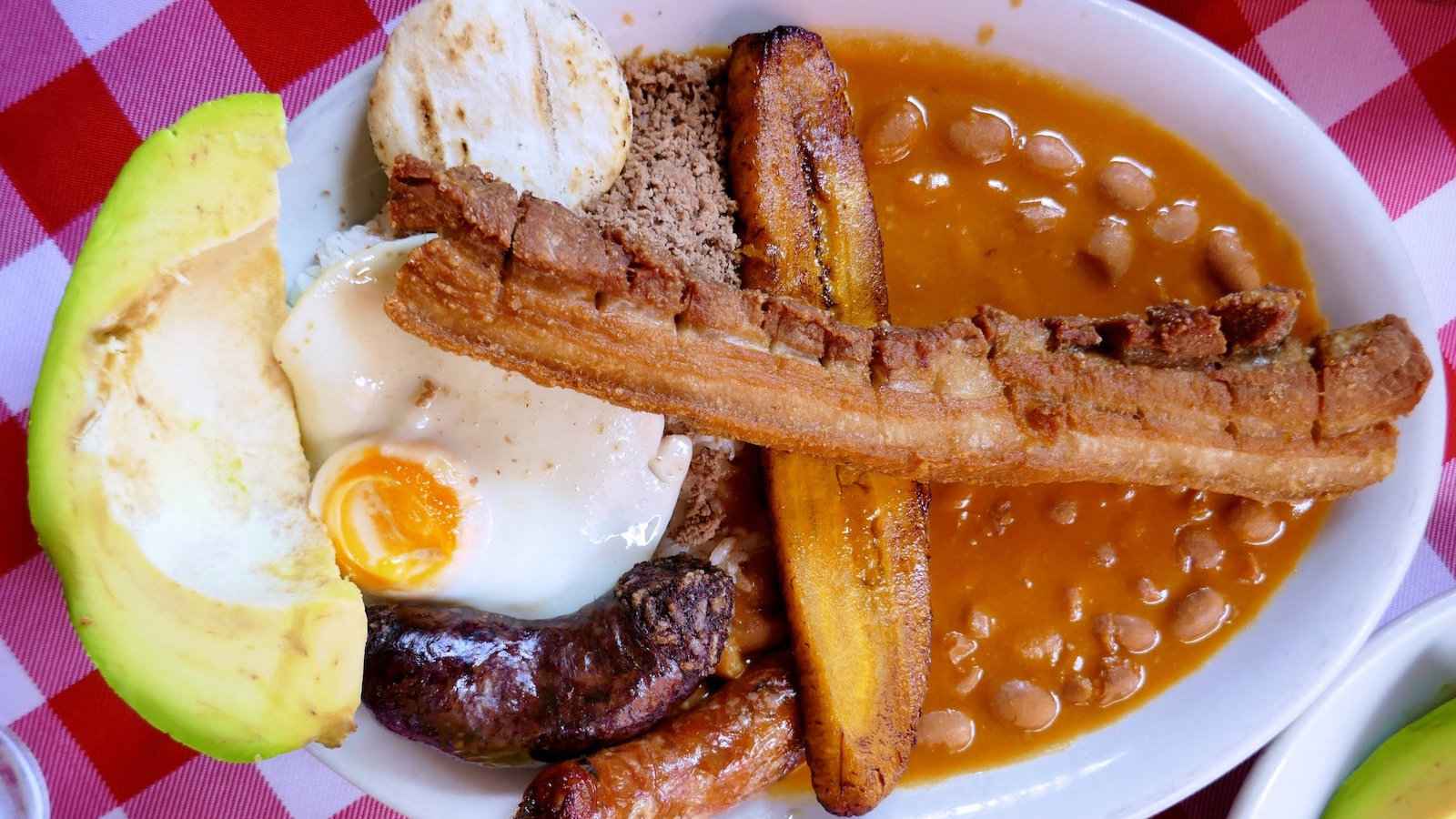 A Colombian Bandeja Paisa is a big plate of food meant to provide energy for an entire day