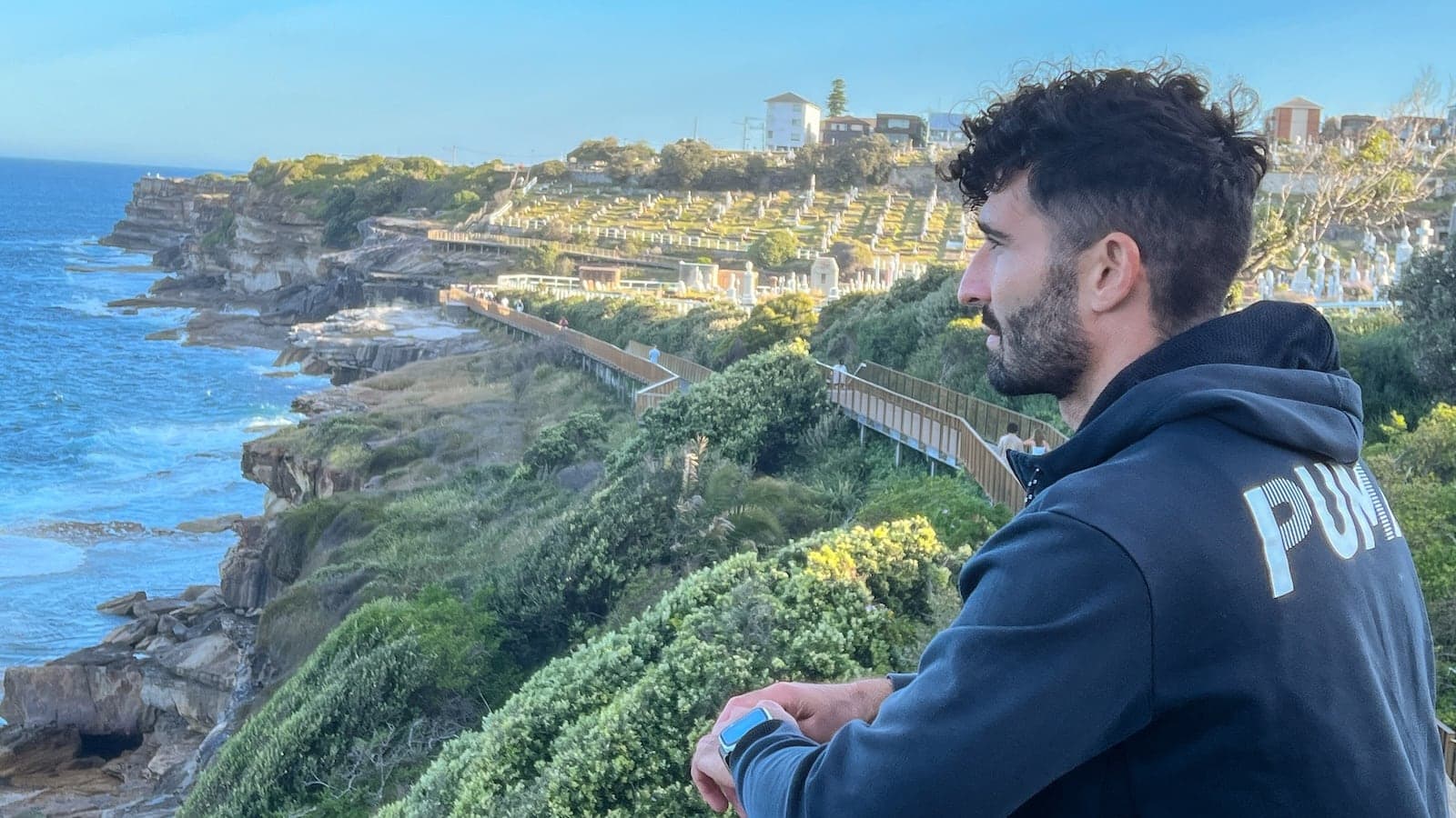 Stefan posing at a lookout on the Bondi to Coogee coastal walk in Sydney.