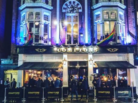 Comptons illuminated at night, a gay bar with a rich history of serving London's gay community.