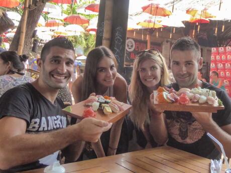 Evolution Bar: Nomadic Boys with friends trying out the delicious sushis