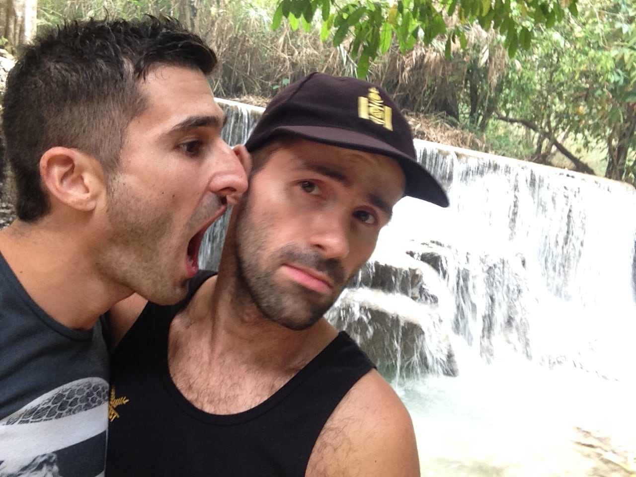 Gay couple arguing at the Kuang Si Falls in Laos.