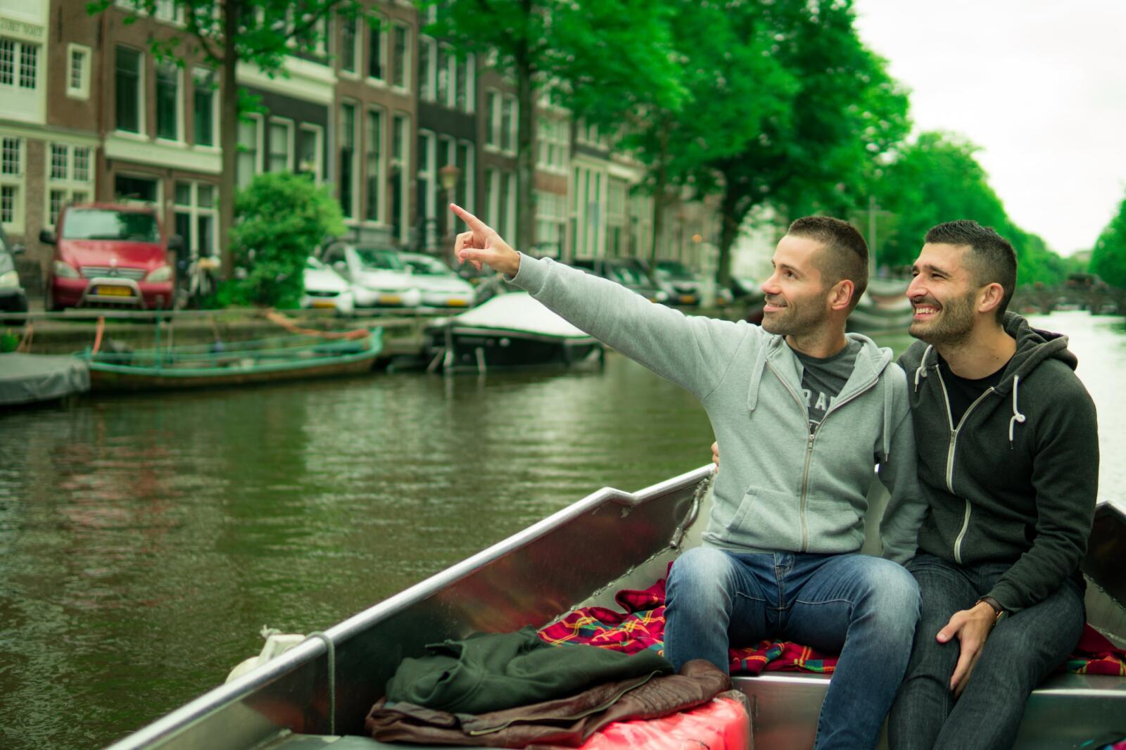 Gay couple in Amsterdam romantic boat ride