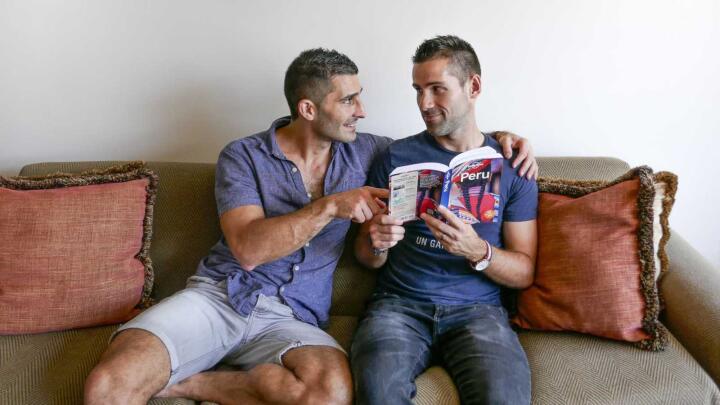 Nomadic Boys in Peru reading The lonely planet to find out if it is safe