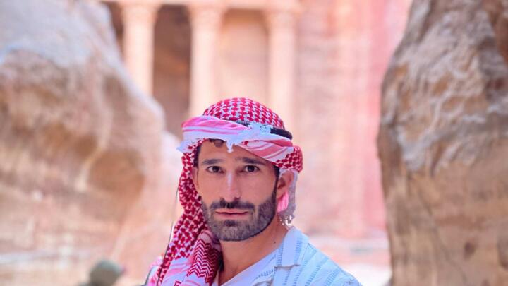 Stefan from Nomadic Boys wearing a kaffiyeh Arabic headscarf.