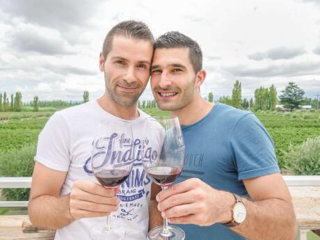 Nomadic Boys, gay couple enjoying a glass of wine