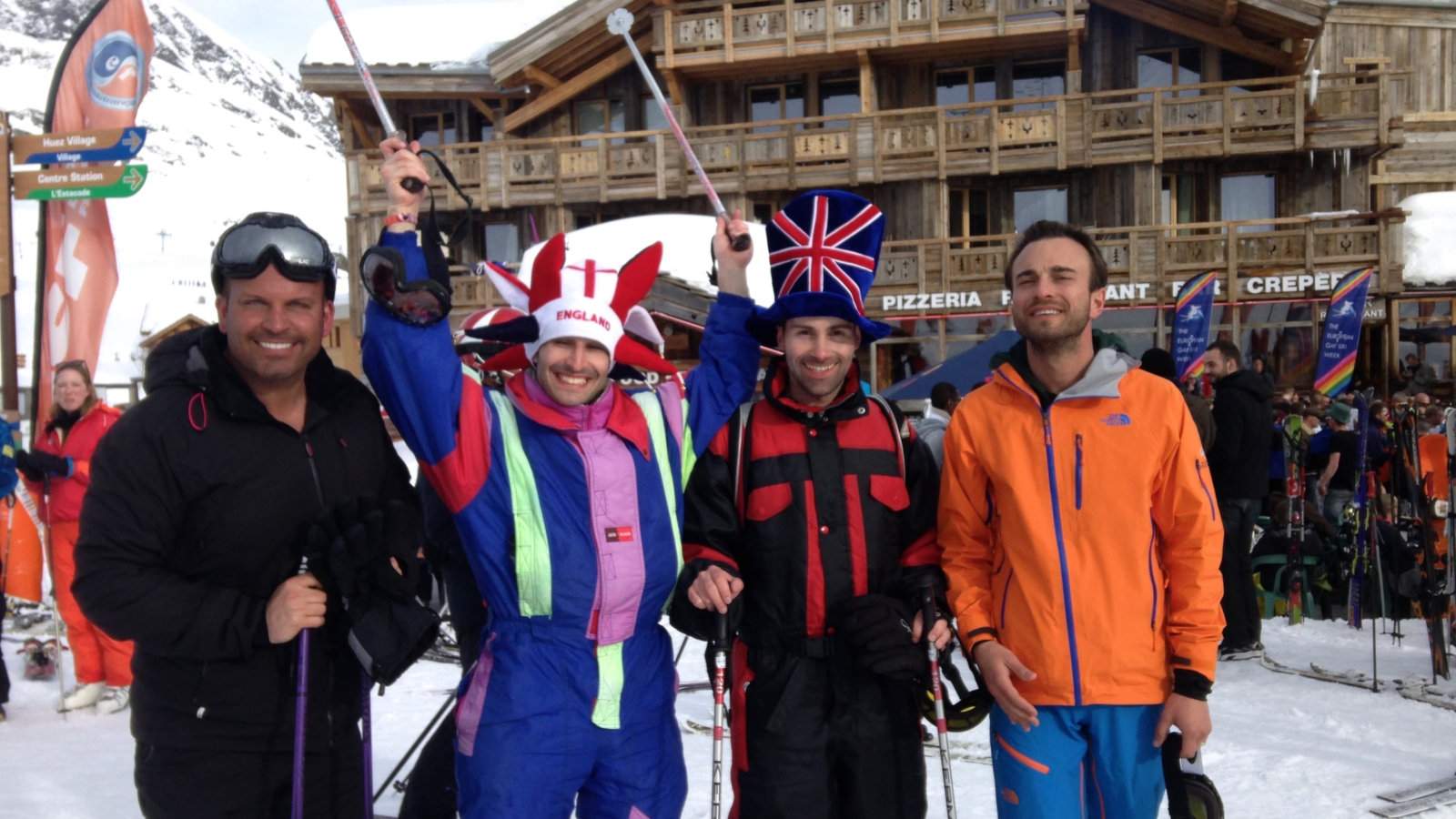 Gay couple with friends at the gay ski week in Alpe d'Huez in France.