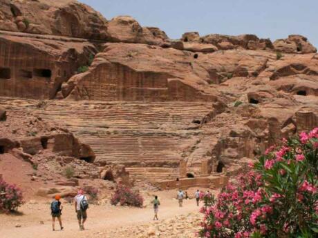 People walking in the beautiful Wadi Rum desert of Jordan.