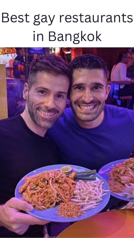 Gay couple eating pad thai at Circus gay restaurant bar in Silom Soi 4 Bangkok, Thailand.