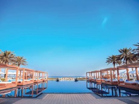 For a relaxing and decadent day, visit the Saadiyat Beach Club in Abu Dhabi - which serves delicious food!