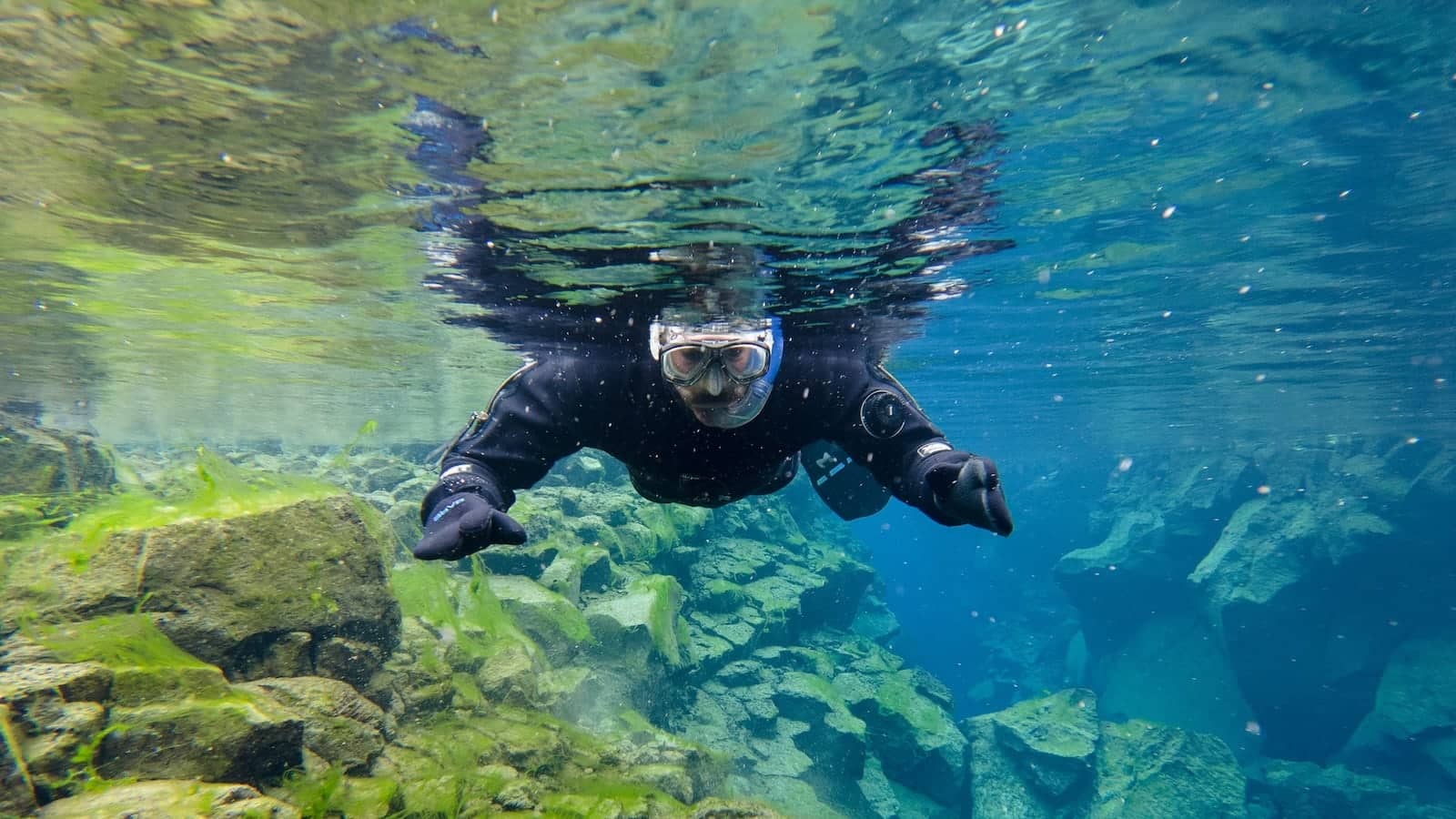 Stefan snorkelling between two continents at Silfra Lake in Iceland.