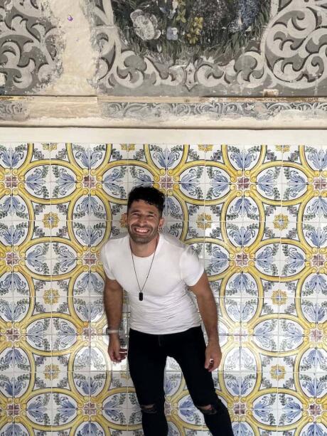 Stefan with tiled wall at Palace of Ahmed Bey.