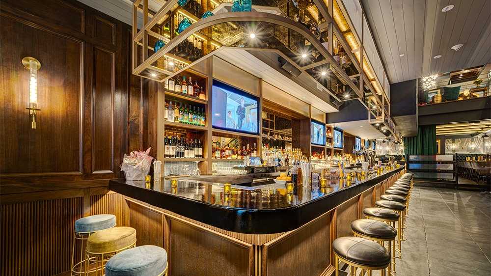 The swanky bar interior at the Dickens gay bar in New York City.