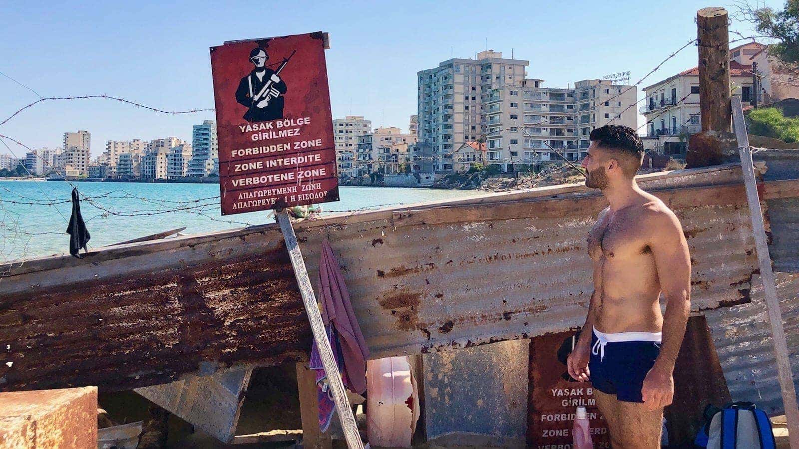 Stefan standing by the Turkish army's barbed wire on Varosi beach.