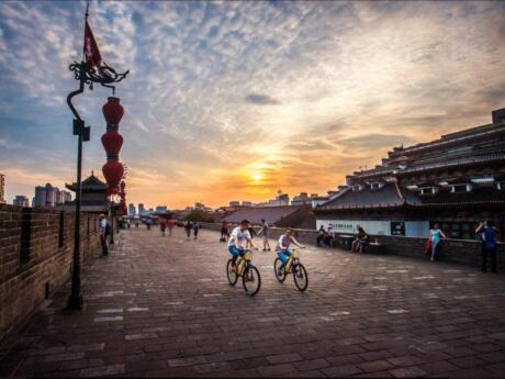 The city walls of Xi'an are the largest and best-preserved ancient city walls in China. You can join a cycling or walking tour to explore the walls and learn more about the city's history