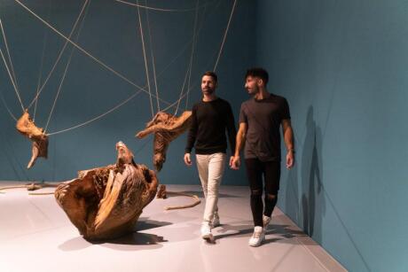 Seby and Stefan of Nomadic Boys walking next to an art installation at the Zeitz Museum.